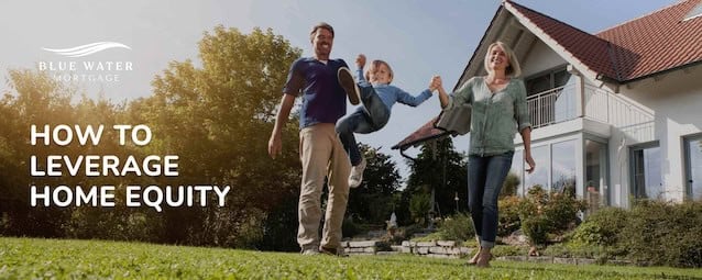 Parents and child standing on the front lawn of their home smiling