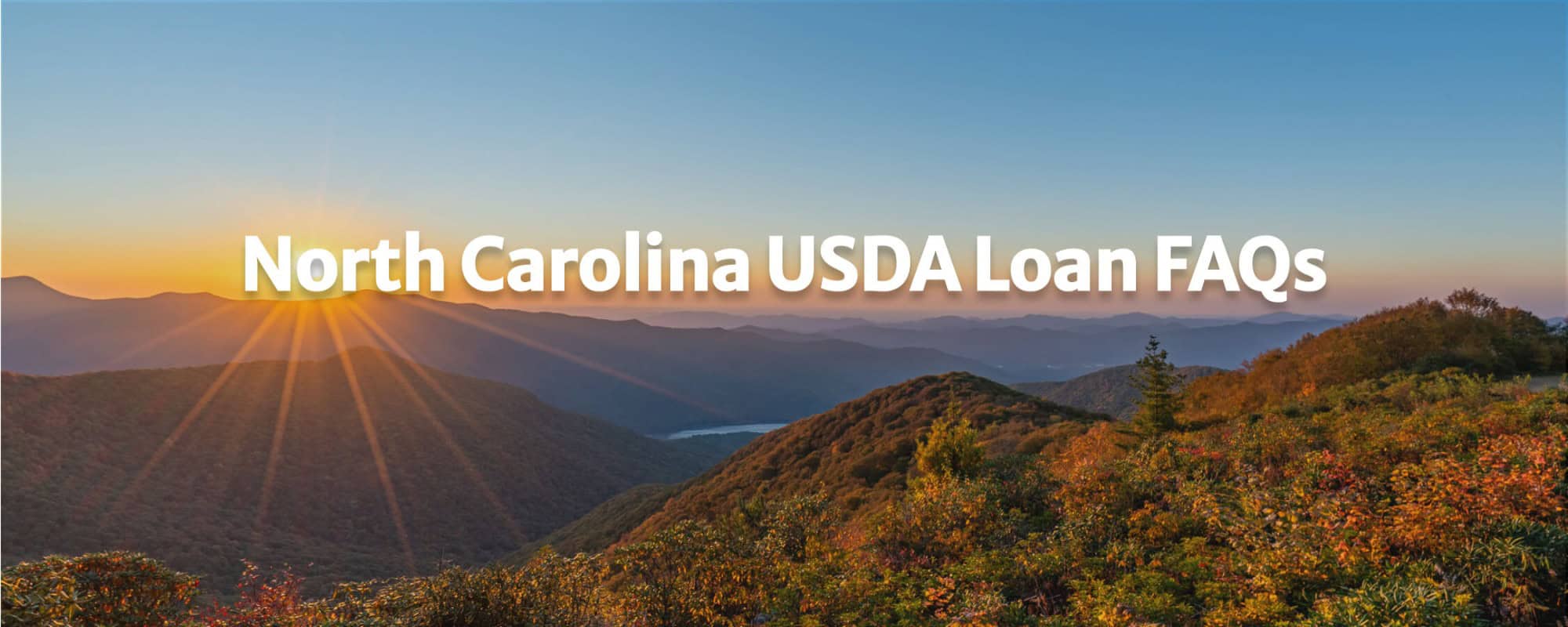 a landscape of tree covered mountains during a sunset with the text reading "north carolina USDA Loan FAQs"