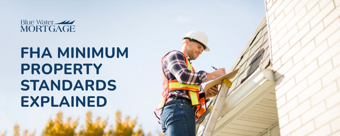 a construction worker with a safety vest and helmet on stands on a ladder with a clipboard in hand, taking notes